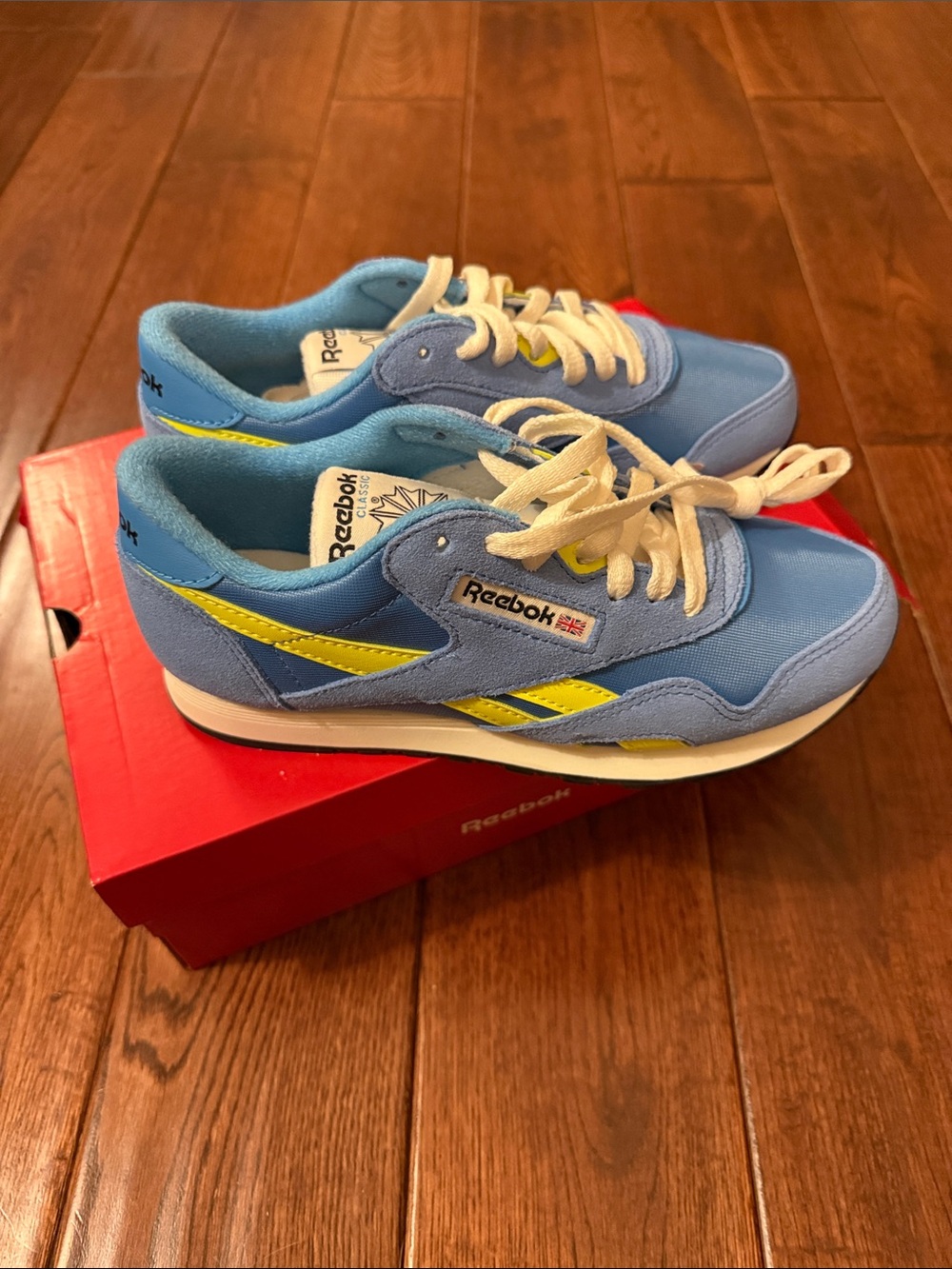 Reebok women’s Light Blue and Yellow Retro Sneakers